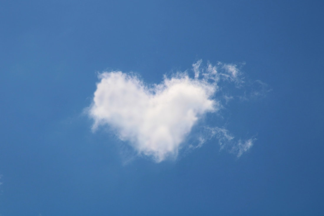 A pictures shows a cloud, which is in the shape of a heart.